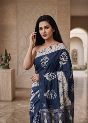 Navy blue floral motif printed mulmul cotton saree, worn by model
