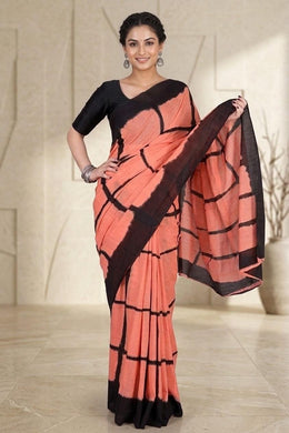 Peach checkered pure cotton mulmul saree with black pallu, worn by model
