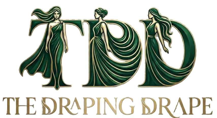 A stylized logo or emblem reading 'TDD' with three draped female figures integrated into the letters, above the words 'THE DRAPING DRAPE' in gold serif text, shown on a transparent checkerboard background.