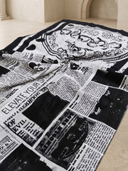 White and black newspaper print mulmul cotton saree, flat lay detail