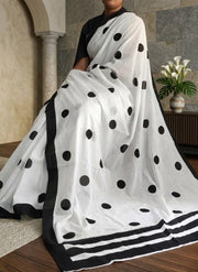 White cotton mulmul saree with black polka dots and black striped border