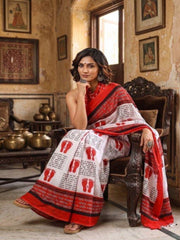 White saree with red Lakshmi charan and shloka print and red border, worn by model