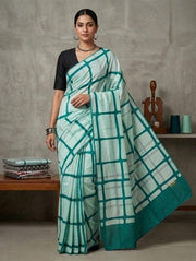 White and teal checkered pure cotton mulmul saree with teal border, worn by model